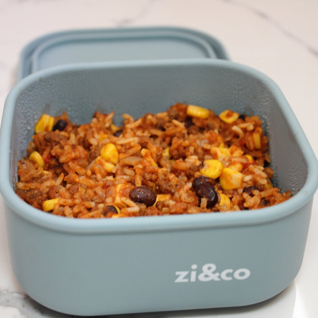 zi&co Silicone Square Lunchbox in sage blue-grey, filled with taco rice, beans and corn