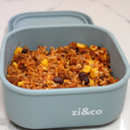zi&co Silicone Square Lunchbox in sage blue-grey, filled with taco rice, beans and corn